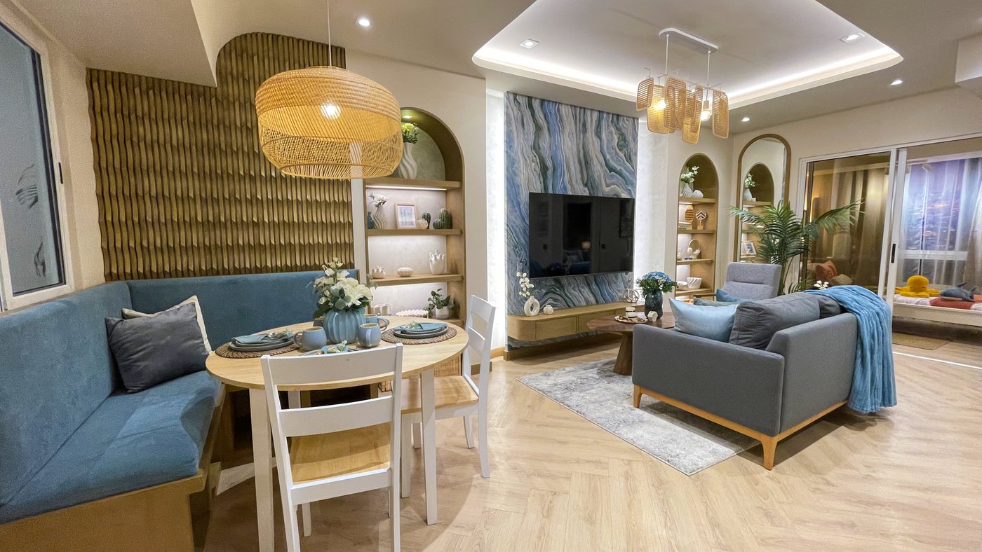 A furnished Calinea Tower model unit living and dining area