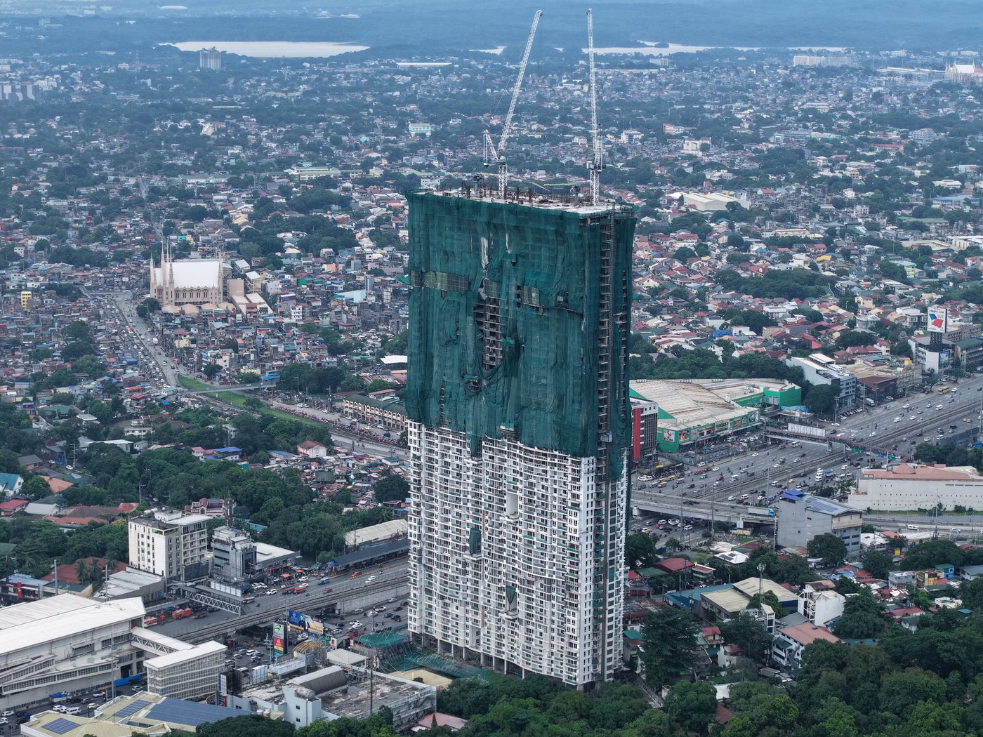 The Erin Heights under construction, aerial view over Commonwealth Avenue, Quezon City