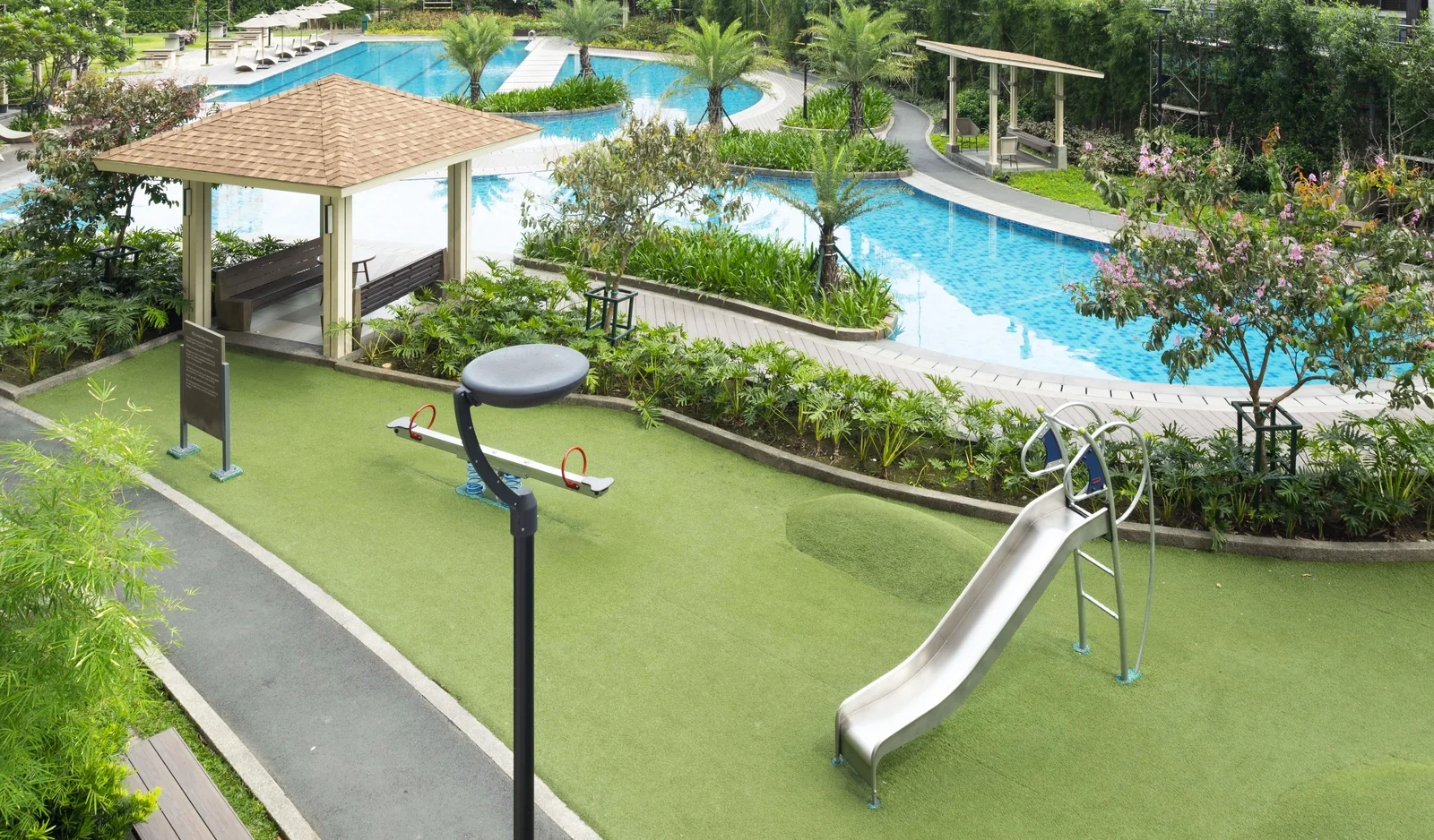 Children's play area beside the pool at Prisma Residences