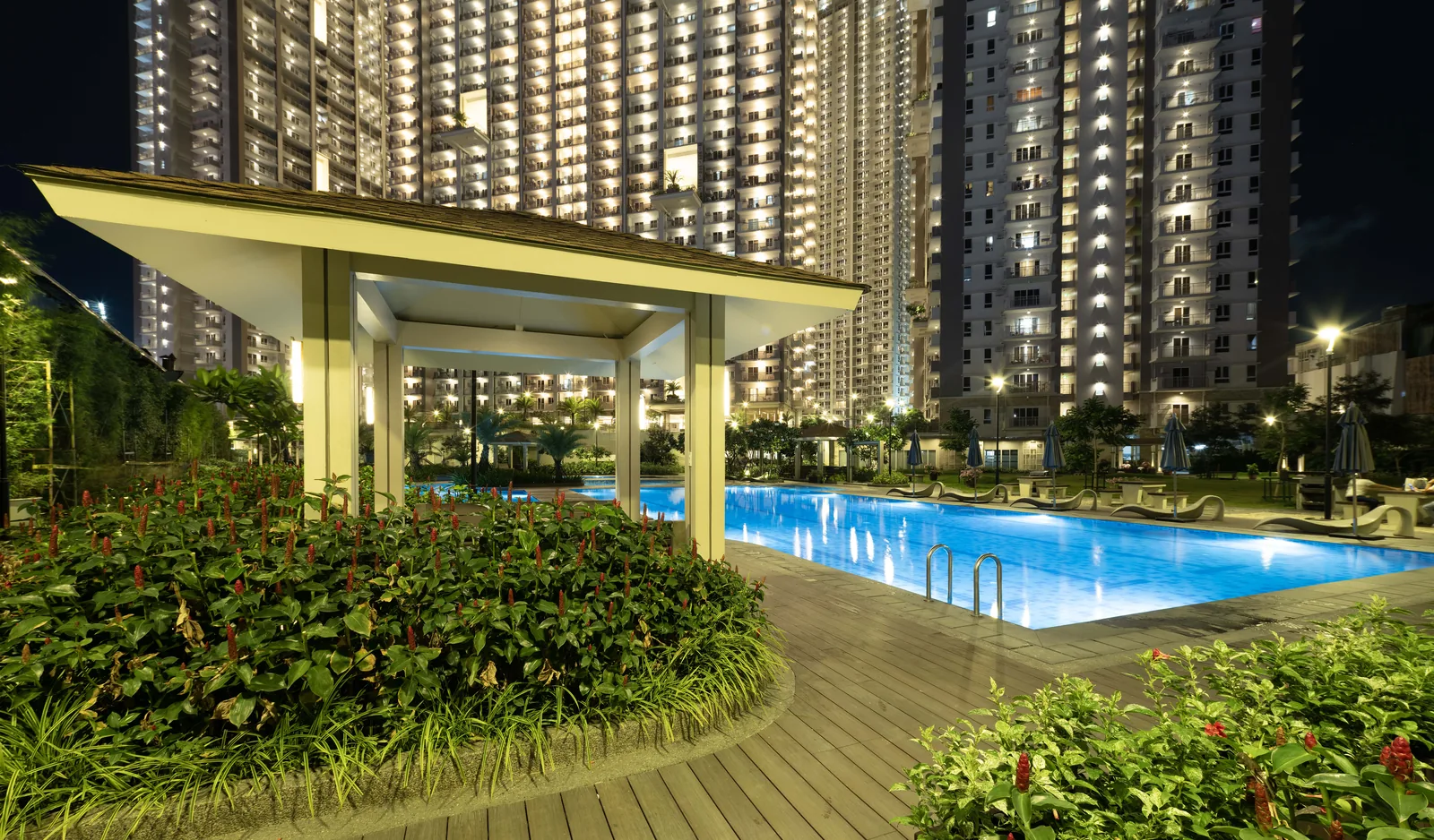 Poolside gazebo at night at Prisma Residences