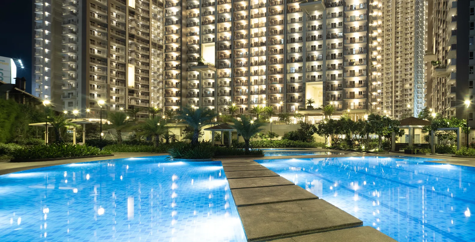 Wide view of the lounge pool between the Prisma Residences towers