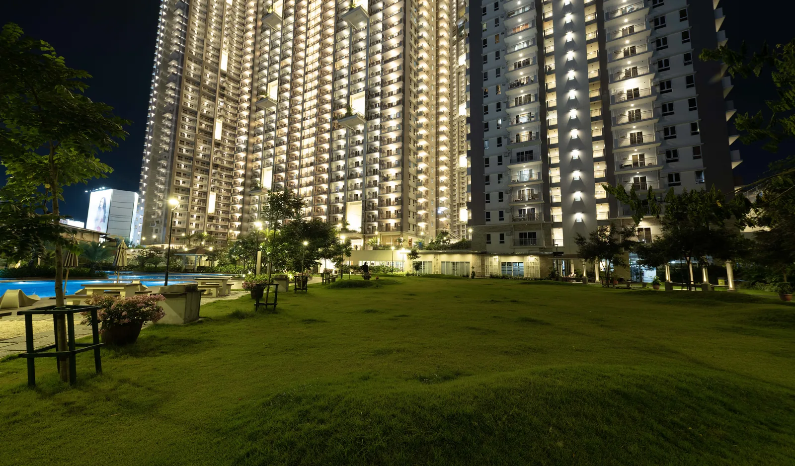 Open lawn at night at Prisma Residences