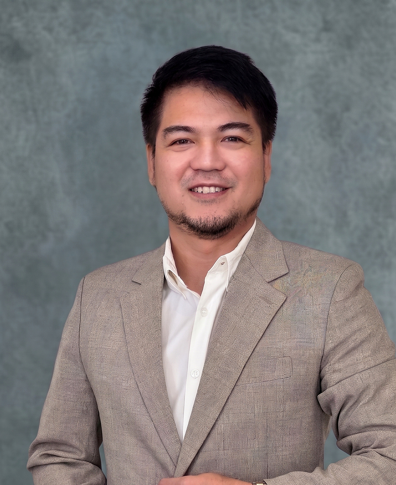 Jeffrey Cepillo — DMCI Homes Sales Director, DHSUD License 007157, standing on a balcony with the Metro Manila skyline